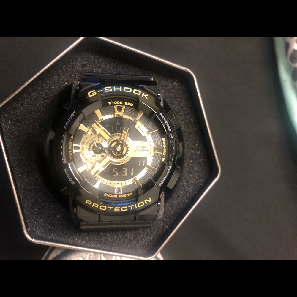 Black and gold G Shock watch